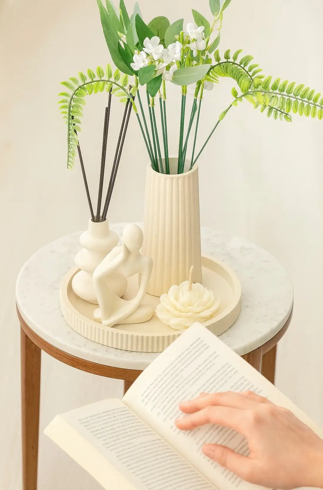 Serenity Decor Set Bundle with ribbed tray, tall vase, organic stacked vase, and abstract figure arranged together in a side table. Zenglow
